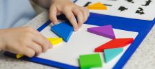 child playing with maths toys