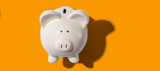 Piggy bank on yellow background