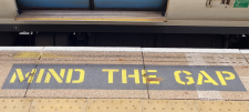 "Mind the gap" text on train station platform 