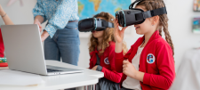 girls using virtual reality headsets