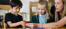 teacher with a boy and girl in reception
