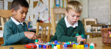 2 boys playing with bricks
