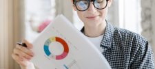 woman looking at financial graphs
