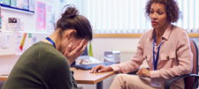 headteacher with upset colleague