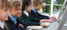 children in classroom on computers