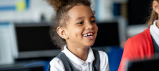 Shining a light on Development Language Disorder (DLD) Happy looking school child