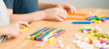 Students using Cuisenaire Rods on a table
