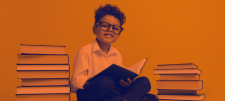 KS2 Reading Fluency Project - boy reading books KS2 Reading Fluency Project - boy reading books