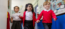 Early Years children in red school uniform