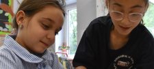 2 girls collaborating in classroom
