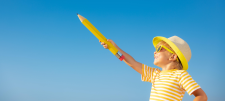Bot holding large pencil at the sky