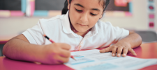 Girl writing with pencil