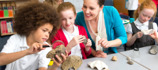 School children with adult overseeing activity