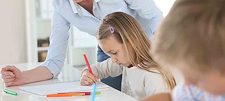 Adult tutor with child