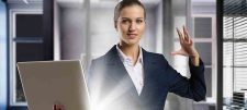 Business woman with glowing laptop