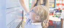 child on whiteboard
