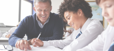 teacher helping 2 pupils