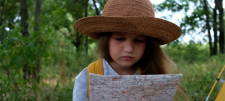 Fieldwork in primary geography: ideas for using the school grounds and local area Girl reading a map