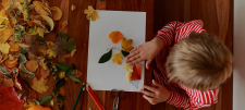Why you should try transient art child playing with leaves
