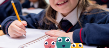 Child writing in a notebook
