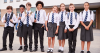 row of children in school uniform