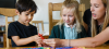 teacher with a boy and girl in reception
