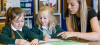female teacher with 2 early years children